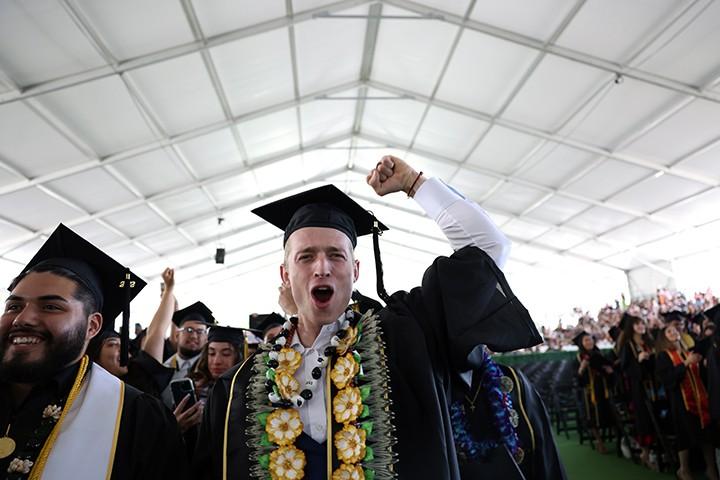 Student celebrating at Commencement